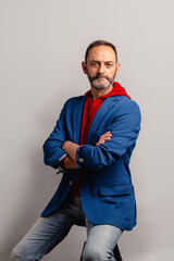 Portrait of sexy mature grey bearded man. Stylish bearded senior bearded man looking at camera isolated on grey background.