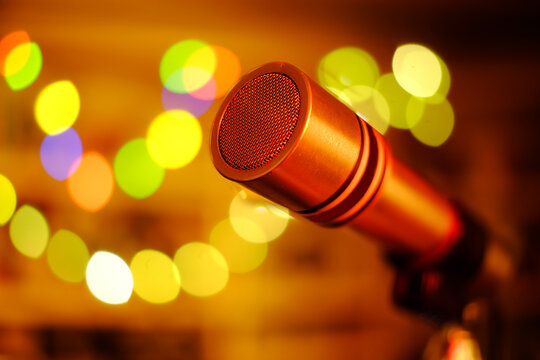 Vintage Microphone On Stage With Bokeh Light, Karoke,Entertainment,Music Concept,Close up Shot with Bokeh Balls, Good Copy Space.