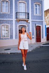 woman walking in the city from lagos portugal 