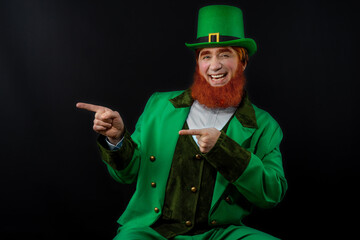 Leprechaun elf on St. Patrick's Day. Cheerful character Irish leprechaun for advertising with a red...