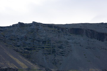 Green Grassy mountain Landscape in the highlands. Travel and nature on a beautiful cold day