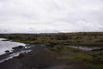 Green Grassy mountain Landscape in the highlands. Travel and nature on a beautiful cold day