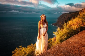 woman in a wedding dress in the mounatins from madeira portugal 