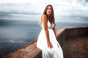 woman in a wedding dress in the mounatins from madeira portugal 