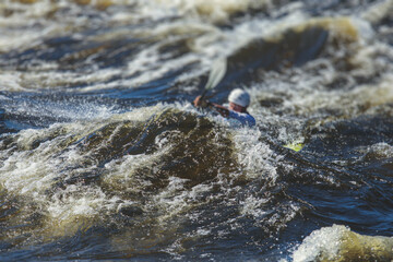 Kayak slalom canoe race in white water rapid river, process of kayaking competition with colorful canoe kayak boat paddling, process of canoeing with big water splash