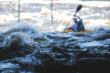 Kayak slalom canoe race in white water rapid river, process of kayaking competition with colorful...