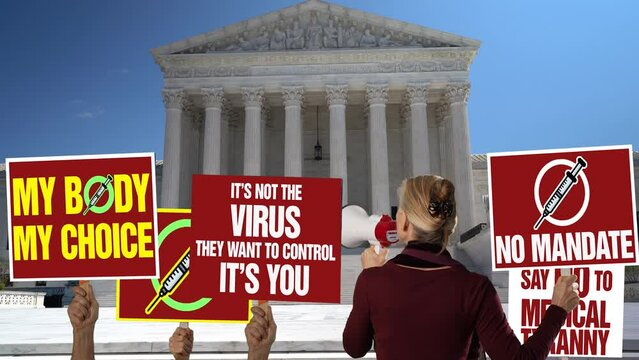 Anti No Vax protestors with signs and megaphone outside the US Supreme Court, judicial branch of government in Washington, DC.