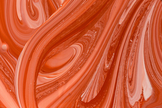 Photos of manufacturing a paint composite color. Mixing acrylic paint in different colors. Marbleized.