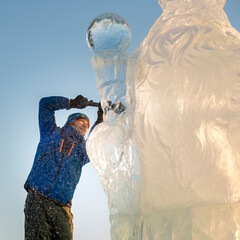 Portrait of a sculptor at work on a figure