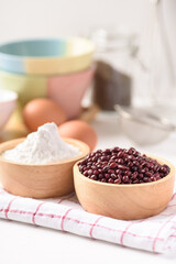Azuki bean and wheat flour on white background. Natural organic products, healthy baking ingredients