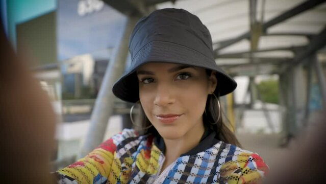 Latin woman take a selfie. beauty woman with a hat and a jacket. 