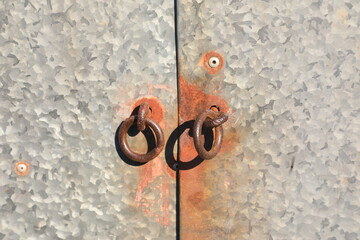 Oxidized rusty metal door ring