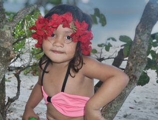 Young Philippine girl (Filipina) at grandmother's beach birthday party. Oriental Mindoro