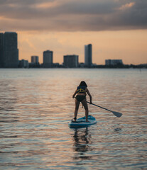 silhouette of a person in a kayak Miami Beach  