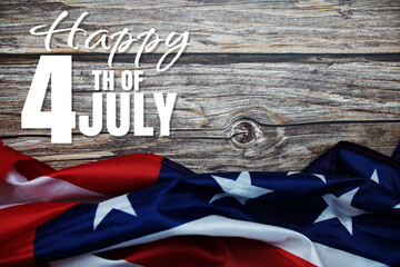 Fototapeta na wymiar Happy 4th of July Independence Day message with American flag on wooden background