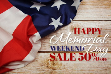Happy Memorial Day Sale message with American flag on wooden background
