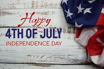 Fototapeta na wymiar Happy 4th of July Independence Day message with American flag on wooden background
