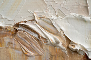 Macro. Abstract art. Expressive embossed pasty oil paints and reliefs. Colors: white,ocher, grey, brown, black.
