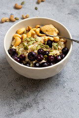 delicious oatmeal porridge with berries for breakfast