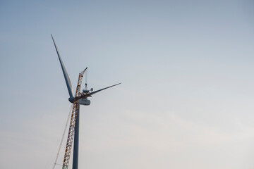 Fototapeta na wymiar Work on windmill with cloud and minimal background, building a windmill