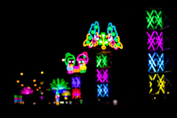 Blured Multi-colored neon lights at night.