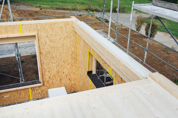 Looking down into the unroofed section of new build wooden home