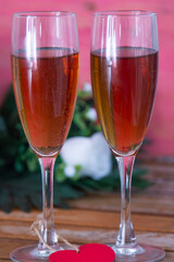 Valentines day background with champagne glasses and red roses