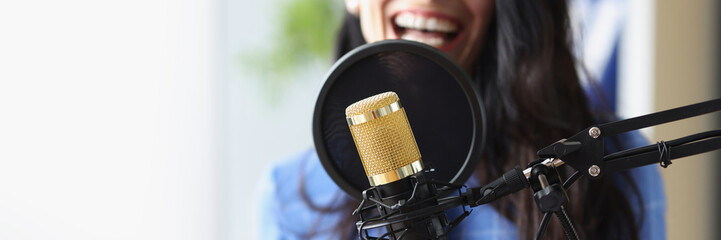 Studio black microphone in background woman sings closeup - obrazy, fototapety, plakaty