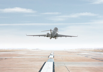 Fototapeta na wymiar Modern corporate business jet take off from airport runway
