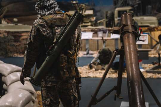 Military soldier with bazooka. War Concept. grenade launcher with a grenade launcher on his back.