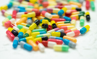 colorful capsule pills on white background