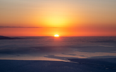Fototapeta na wymiar Beautiful Arctic sunset. Panoramic scenic colorful sky at dawn. Aerial view. Sunrise bright sky with White Sea. Top View from high altitude.