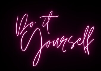 Do it yourself neon text isolated on black background.