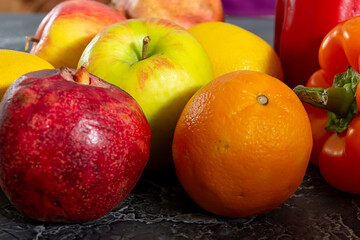 Assorted organic vegetables and fruits in a wicker basket