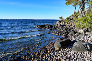 bay with stone beach lake Vattern in Sweden