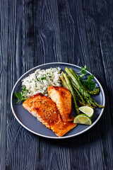 fried salmon fish fillet with rice and asparagus