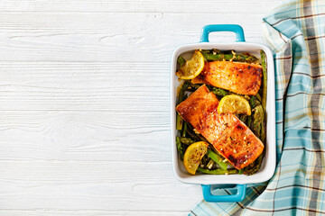 baked salmon fish fillet with asparagus and lemon