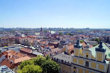 Houses, roofs, a church - a view of the historical part of one of the cities in Poland - Poznan, very popular with tourists