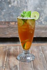 Lemon mint ice tea on wooden table