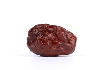 Close-up of a dried date on a white background.