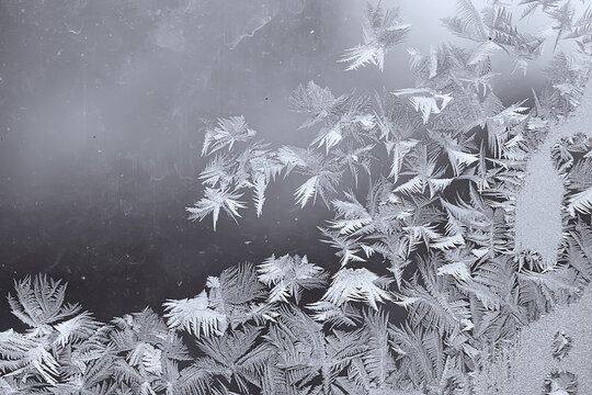 frost patterns on window glass, abstract background winter rime snow