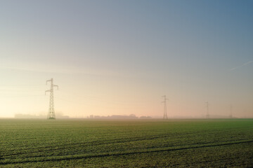 power lines in the field. Pylon in the countryside