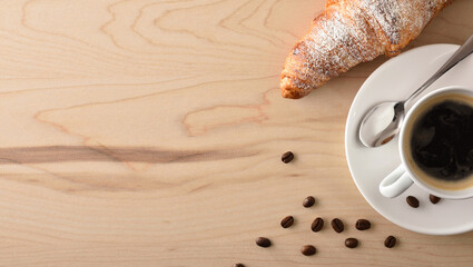 Breakfast table with coffee and pastries background top view