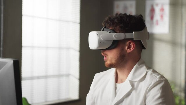 Portrait of a professional Caucasian male doctor who conducts a master class in virtual reality glasses