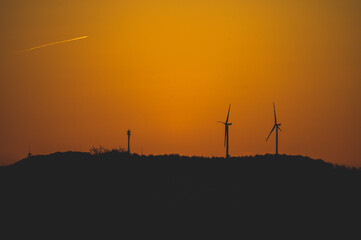 Fototapeta premium wind turbines at sunset