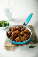Homemade meatballs with fresh spinach