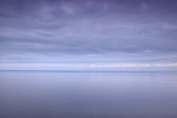Fototapeta premium sky above water / texture background, horizon sky with clouds on the lake