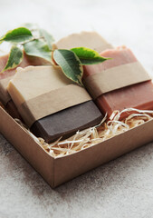 Handmade soap bars and green leaves