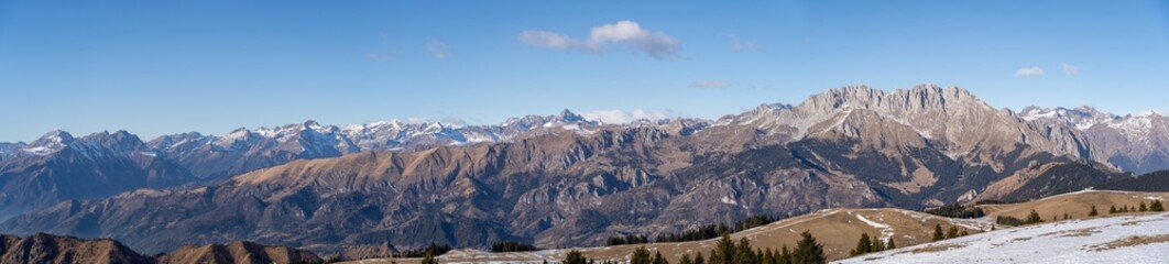 Fototapeta na wymiar Amazing landscape to the Orobie and Presolana mountain range in winter dry season. View from Monte alto at Monte Pora. Orobie alps, Bergamo, Lombardy, Italy