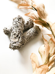 california white sage, beautiful layout and top view, incense and dried flowers on a white background